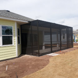 Bright, enclosed sunroom with large windows